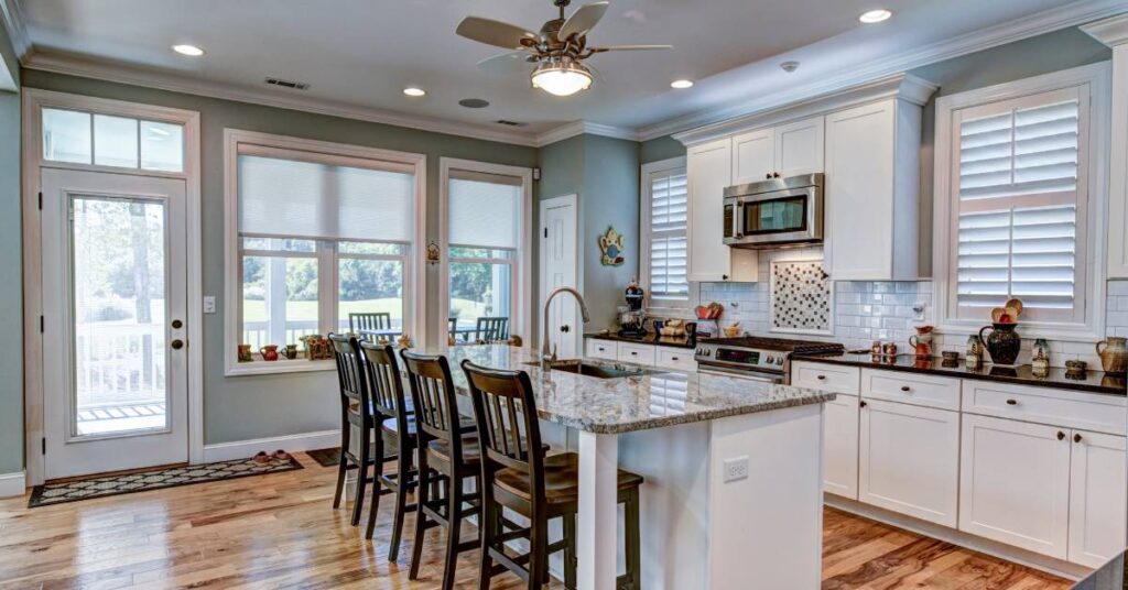 A new, modern, and beautifully designed kitchen remodel featuring granite countertops and stainless steel appliances.